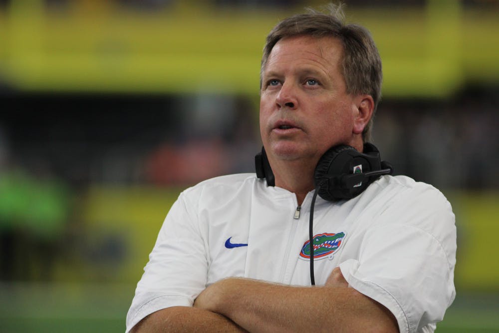 <p>UF coach Jim McElwain watches on during Florida's 33-17 loss against Michigan at AT&amp;T Stadium in Arlington, Texas.</p>