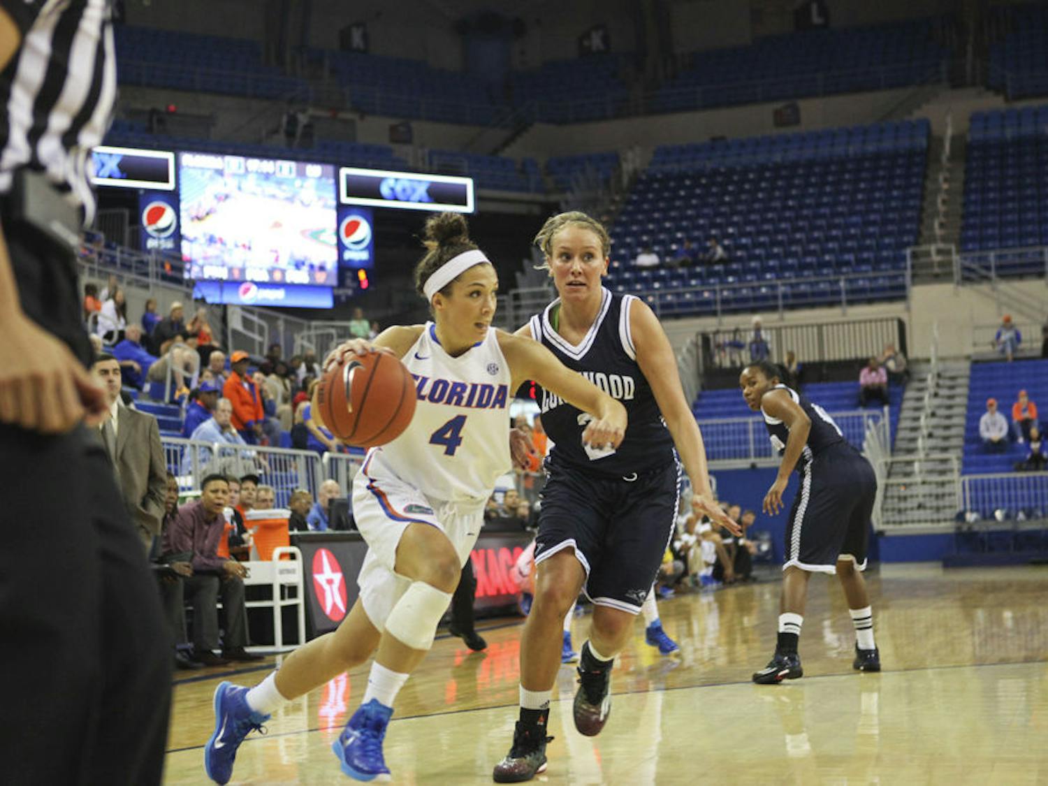 Carlie Needles drives into the paint during Florida's win against Longwood.