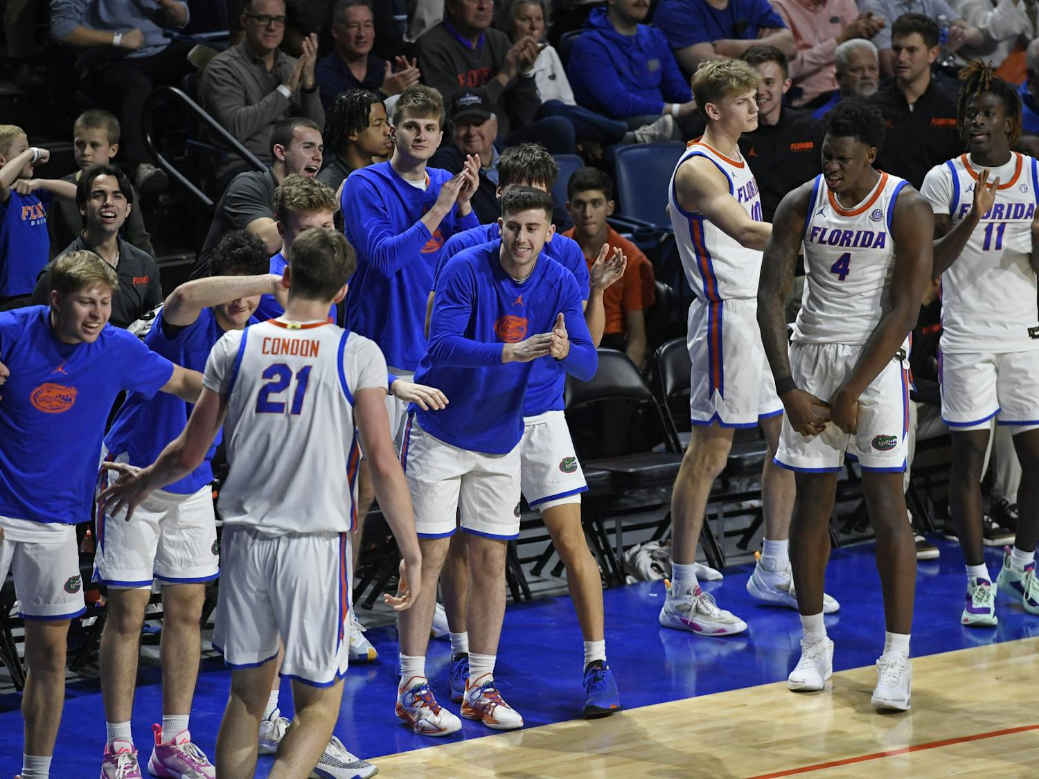 Florida men's basketball players celebrate on the bench in a win over Arkansas on Saturday, January 13, 2024. 