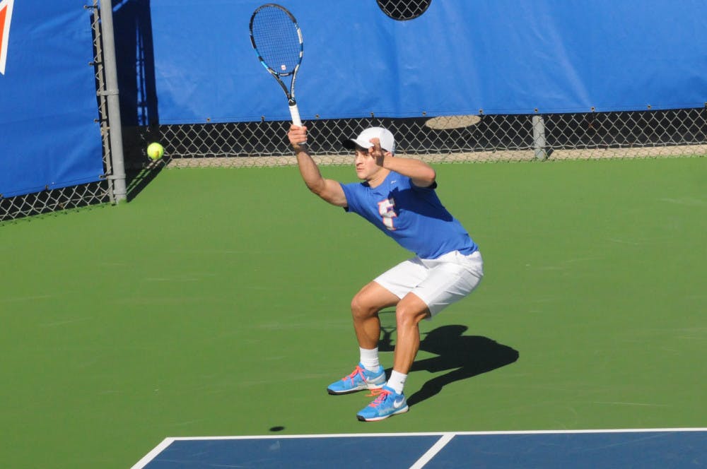 <p>Elliott Orkin returns a serve during Florida's 6-1 win over Troy on Jan. 17, 2016, at the Ring Tennis Complex.</p>
