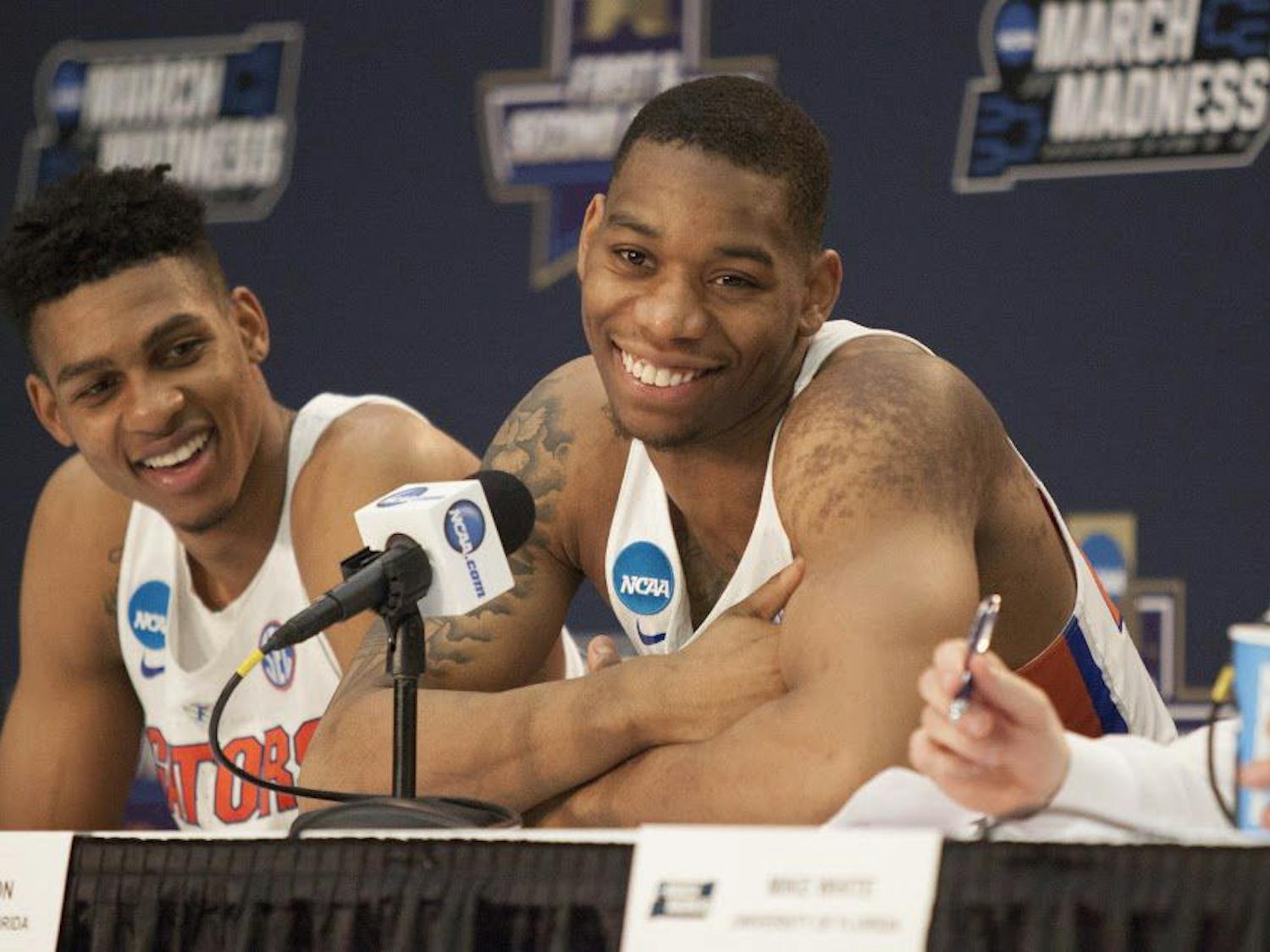 Florida forwards Justin Leon and Devin Robinson (left) smile during a press conference following the Gators' 65-39 win against Virginia in the NCAA Tournament on Saturday in Orlando, Florida.