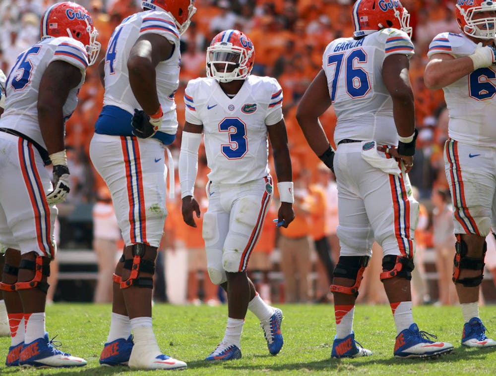 <p>Freshman quarterback Treon Harris directs players during the fourth quarter of Florida's 10-9 victory against Tennessee on Oct. 4 at Neyland Stadium in Knoxville.</p>