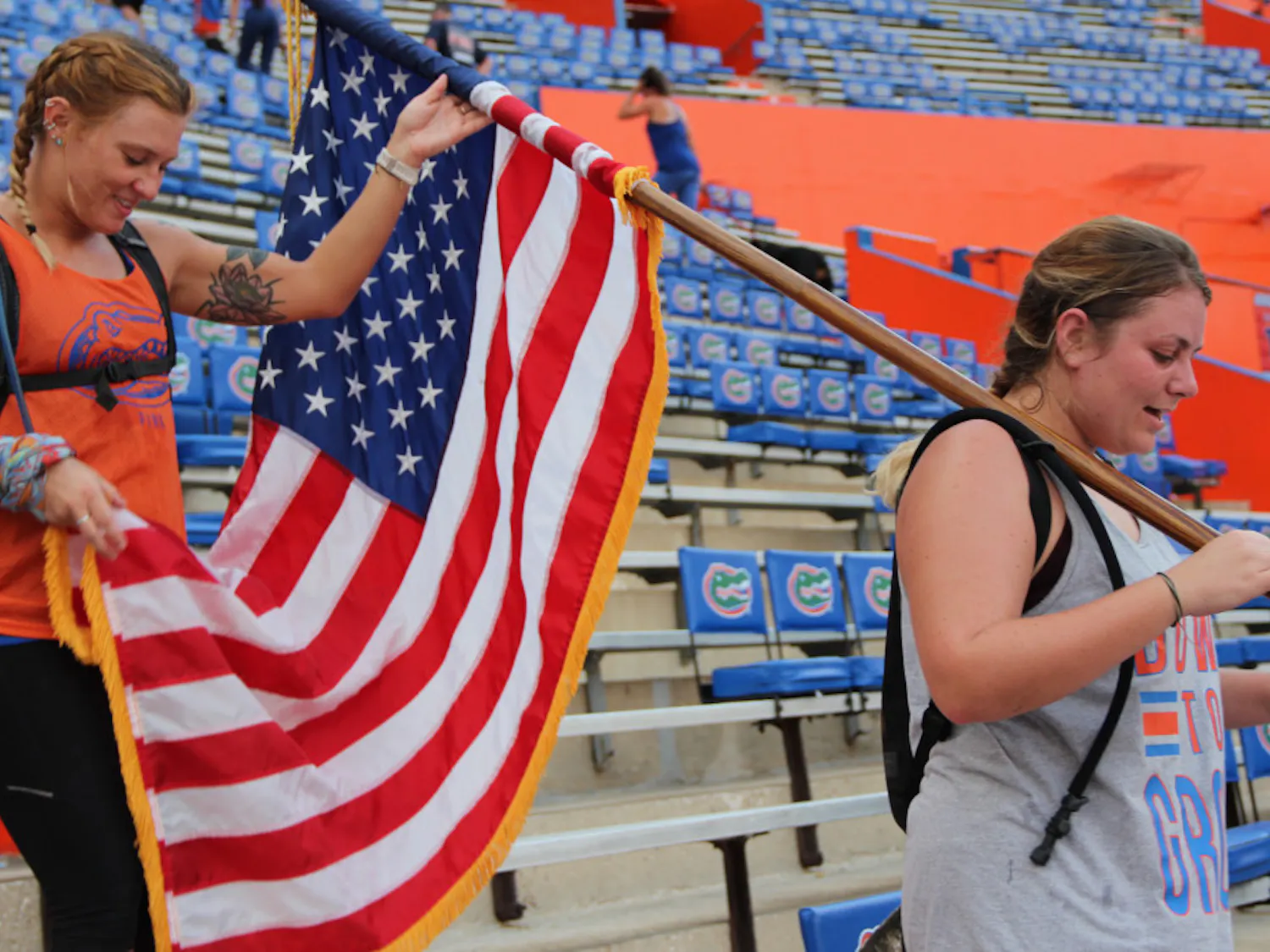 Friends Erica Ross (left), a 26-year-old UF marine biology doctoral student and Evan Hill (right), a 24-year-old UF marine science alumna climb the stairs at Ben Hill Griffin Stadium in honor of the fallen servicemen and women of 9/11. Both women felt proud of each other for completing the climb.