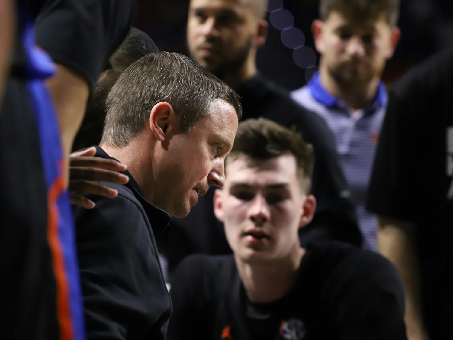 Mike White leads a team huddle Feb. 19. His Gators face the Texas A&M Aggies Thursday in the SEC Tournament. 