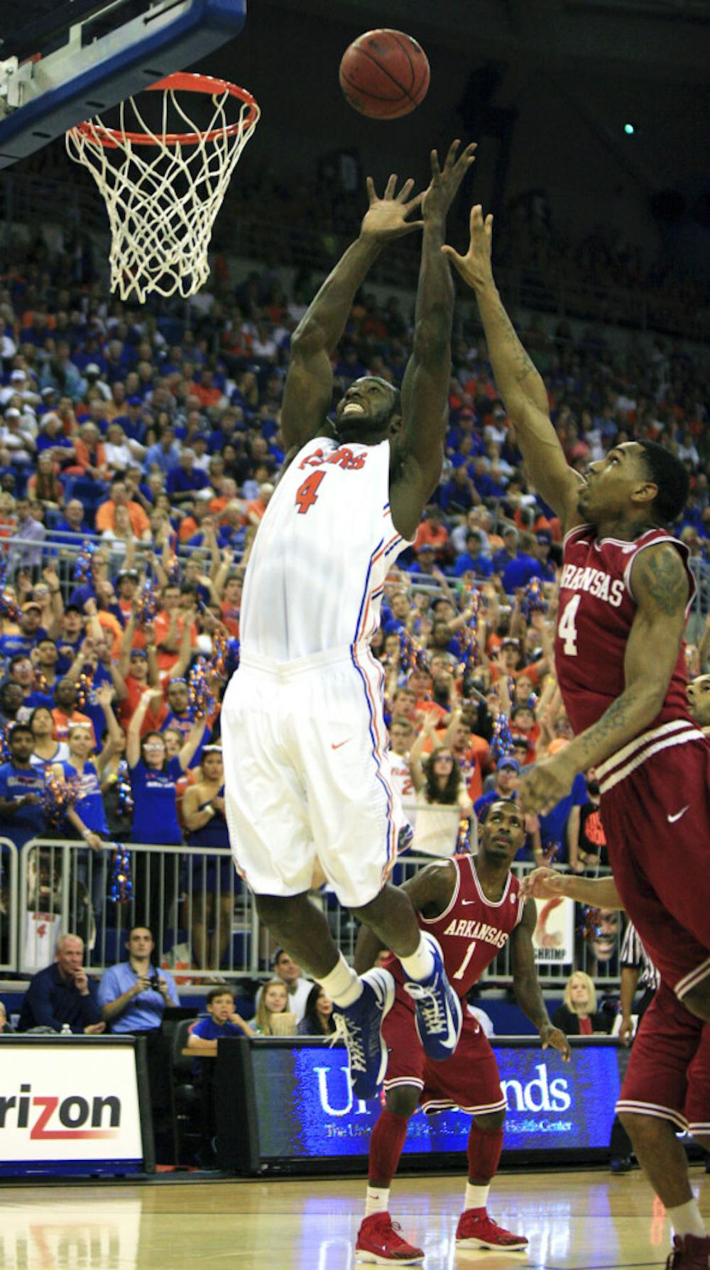 <p align="justify">Patric Young (4) attempts an alley-oop dunk during Florida’s 71-54 win against Arkansas on Saturday in the O’Connell Center.</p>