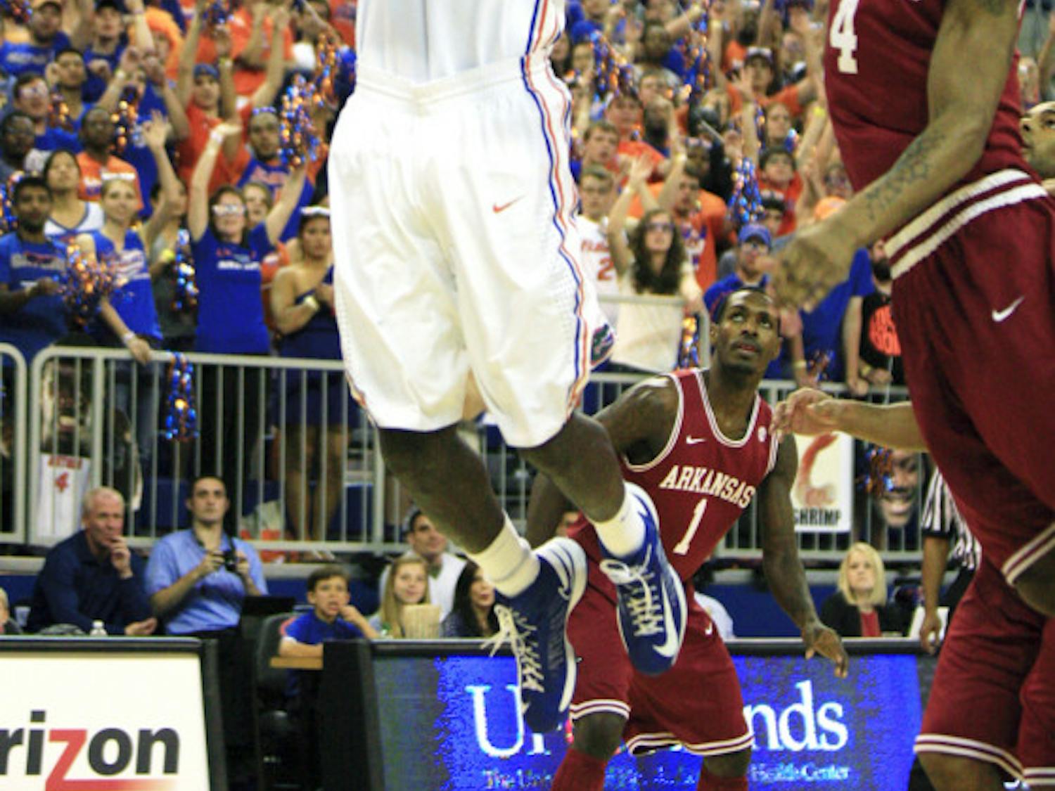 Patric Young (4) attempts an alley-oop dunk during Florida’s 71-54 win against Arkansas on Saturday in the O’Connell Center.