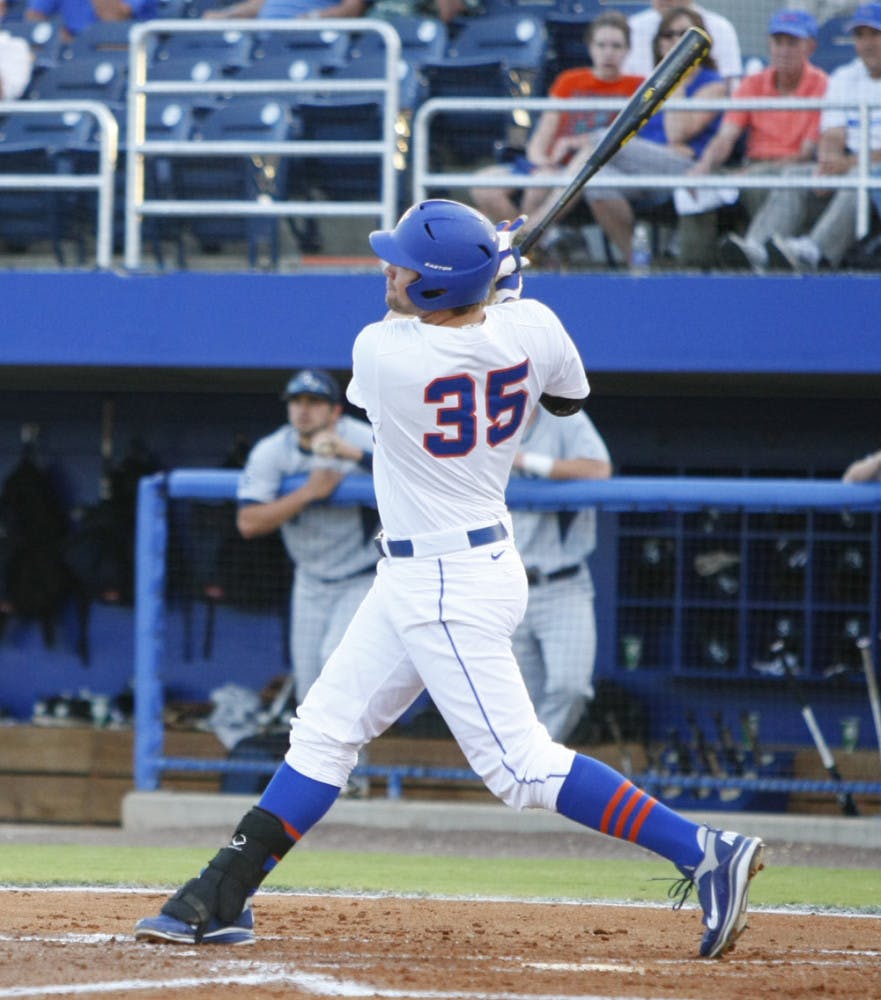 Florida junior Brian Johnson hits a three-run home run during the first inning of Tuesday’s win against Georgia Southern. Johnson tied a career high with five RBI in the win.