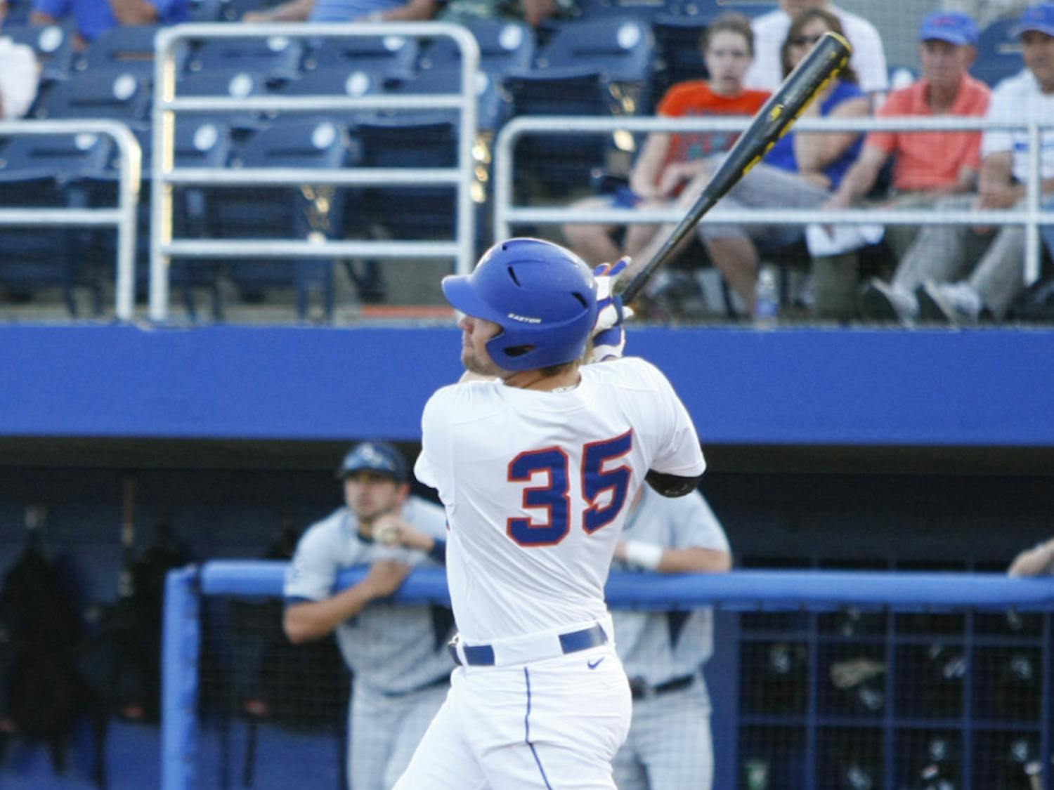 Florida junior Brian Johnson hits a three-run home run during the first inning of Tuesday’s win against Georgia Southern. Johnson tied a career high with five RBI in the win.