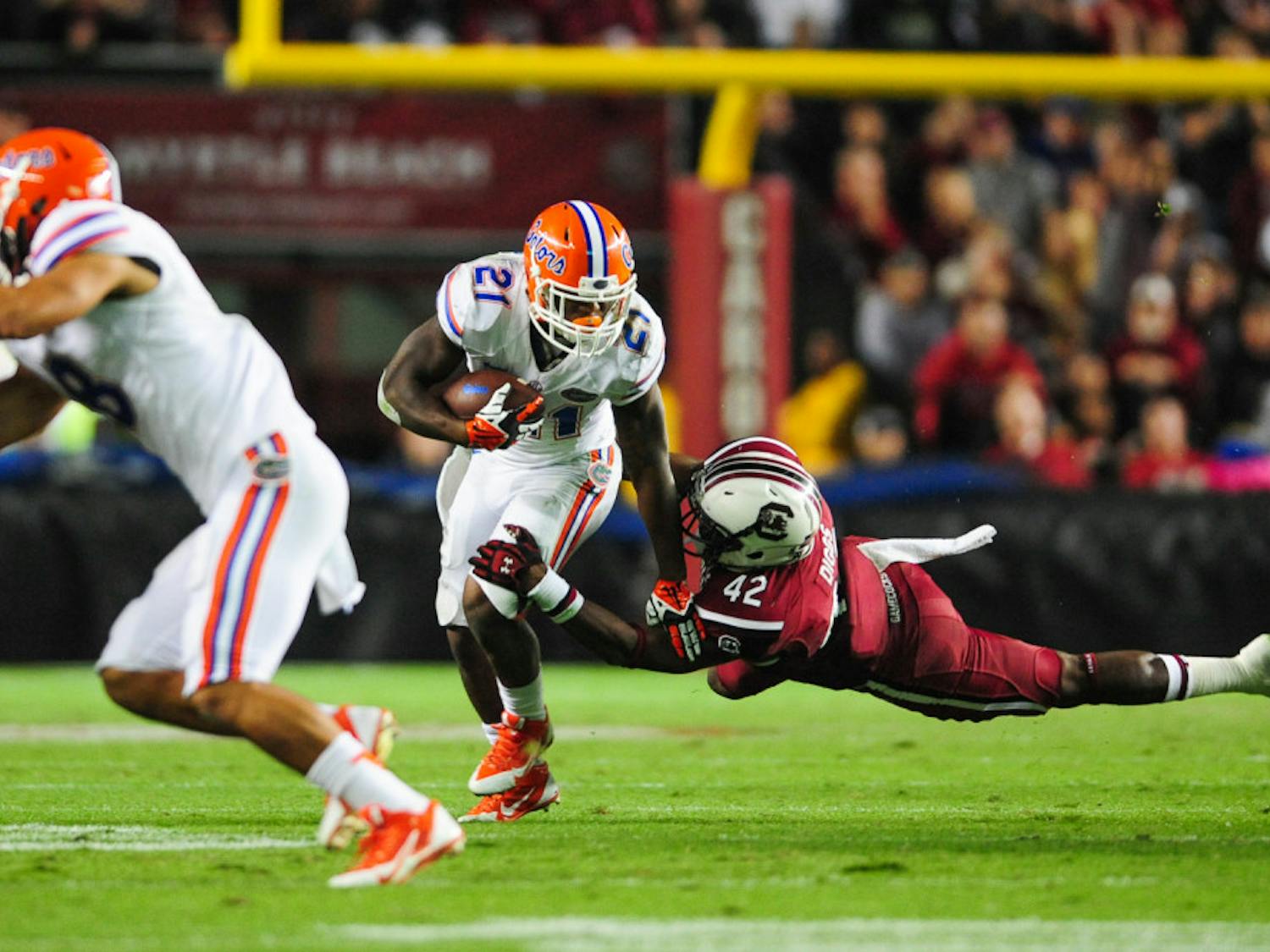 Freshman running back Kelvin Taylor tries to escape a tackle during Florida's 19-14 loss to No. 10 South Carolina on Saturday night at Williams-Brice Stadium in Columbia, S.C.