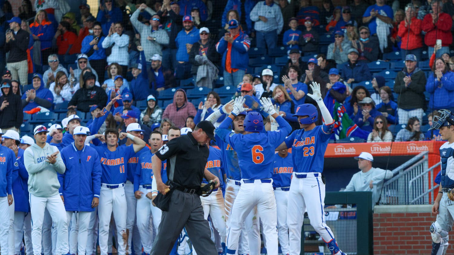 Florida infielder Tyler Shelnut celebrates with his teammates after he hit a home run in the Gators&#x27; 16-2 win against the Charleston Southern Buccaneers Saturday, Feb. 18, 2023.