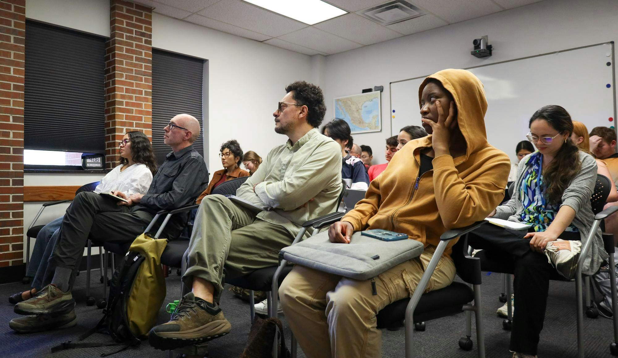 A crowd of about 20 listen to author Michael Deibert speak, Friday March 27, 2026 at Grinter Hall in Gainesville, Fla.