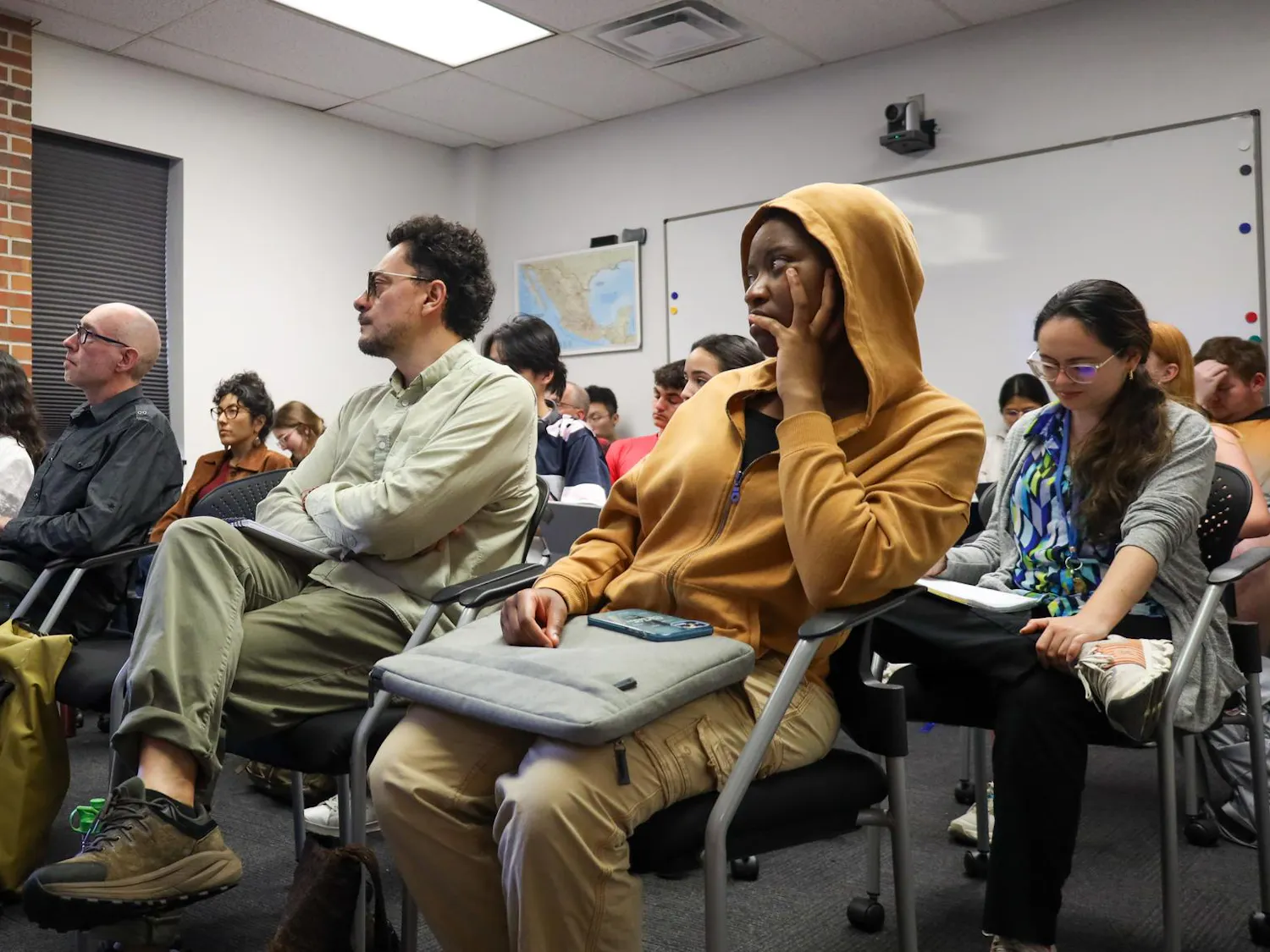 A crowd of about 20 listen to author Michael Deibert speak, Friday March 27, 2026 at Grinter Hall in Gainesville, Fla.