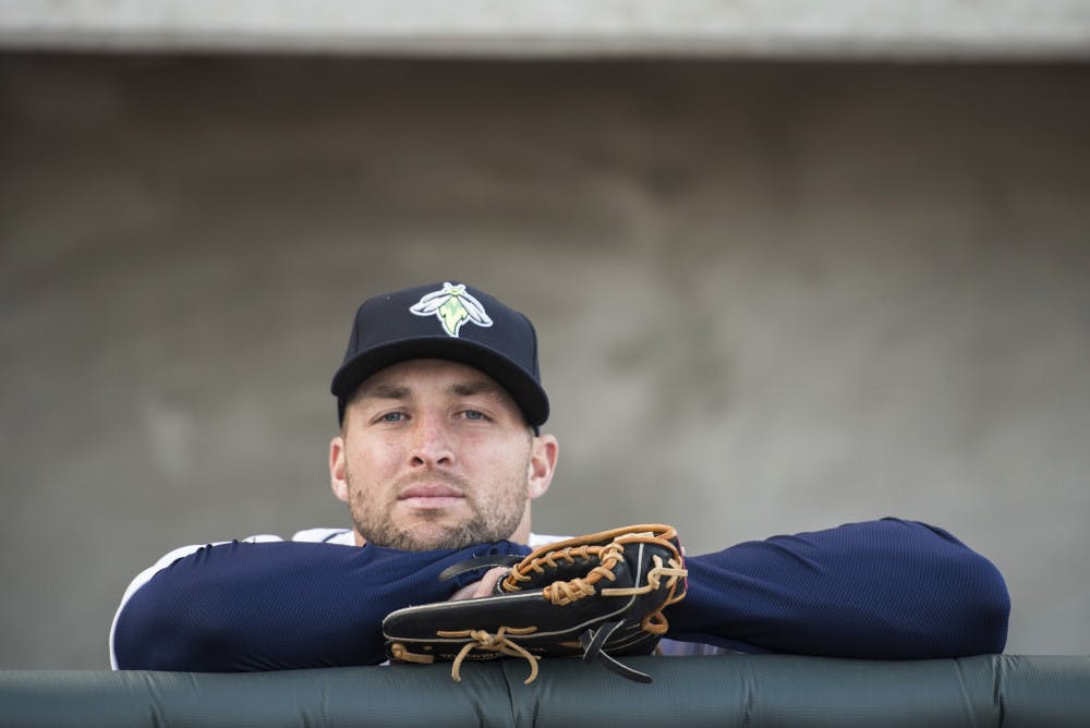 <p>Columbia Fireflies outfielder Tim Tebow looks out from the dugout before the team's minor league baseball game against the Augusta GreenJackets on Thursday, April 6, 2017, in Columbia, S.C. Columbia defeated Augusta 14-7. (AP Photo/Sean Rayford)</p>