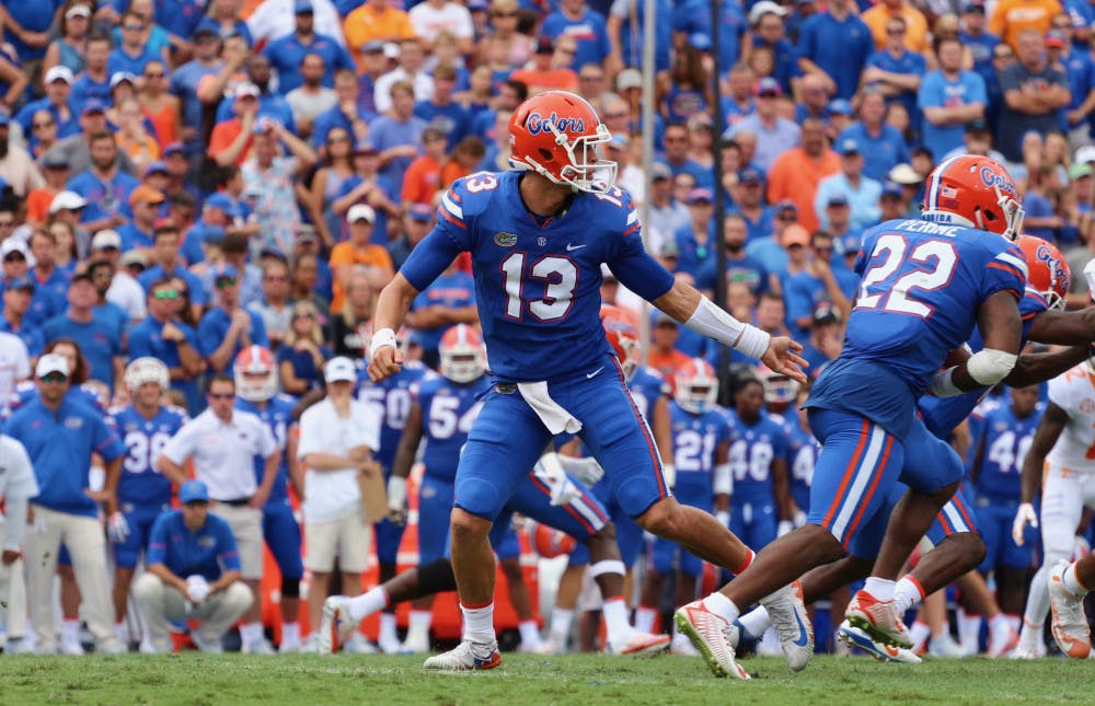 <p>Feleipe Franks hands off the ball to Lamical Perine during Florida's 26-20 win against Tennessee on Saturday at Ben Hill Griffin Stadium.</p>