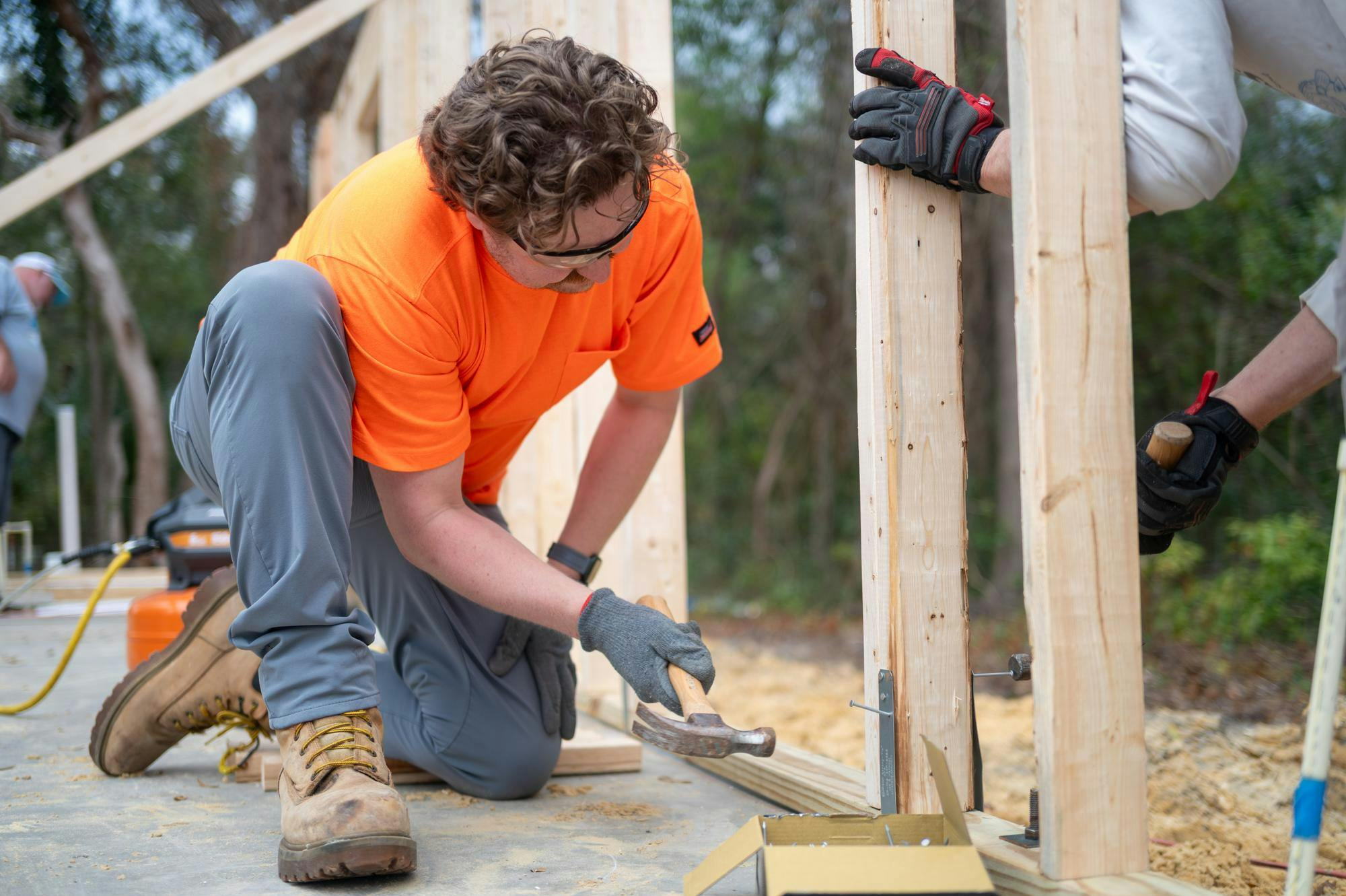 Volunteers from Habitats for Humanity work together to build a house from scratch, Saturday, Feb. 28, 2026, in High Springs, Fla.
