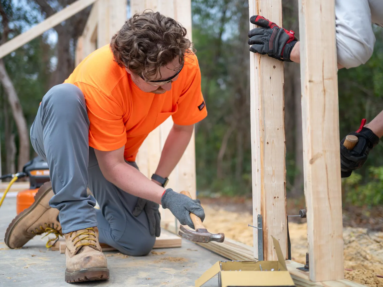 Volunteers from Habitats for Humanity work together to build a house from scratch, Saturday, Feb. 28, 2026, in High Springs, Fla.