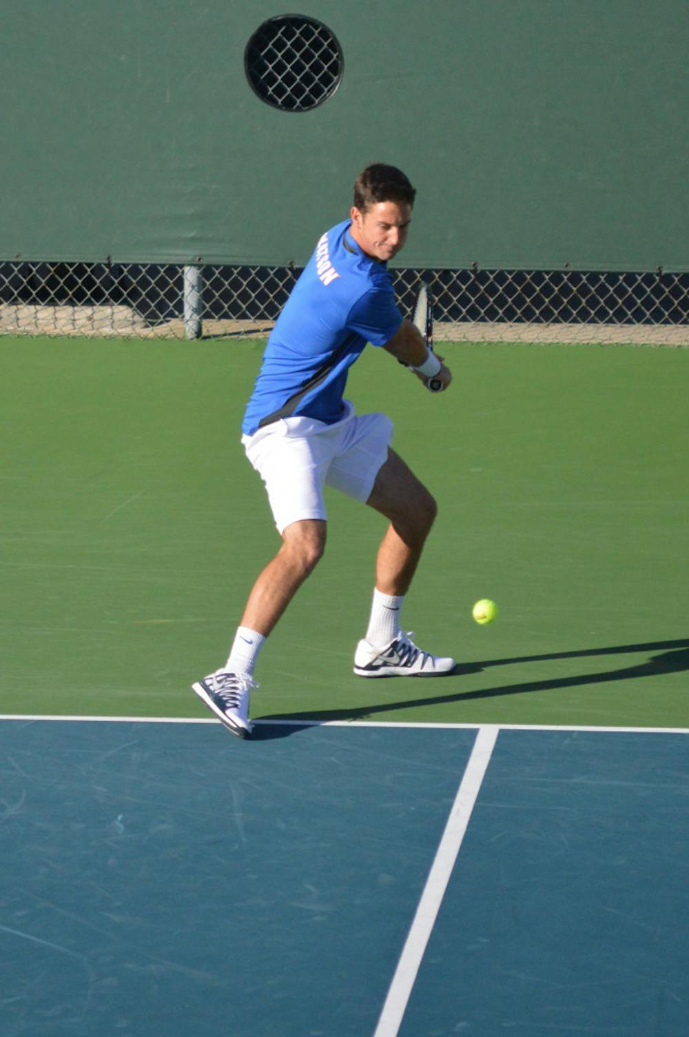 <p>Sophomore Gordon Watson hits the ball during Florida's 5-2 win against North Florida on Jan. 22.</p>