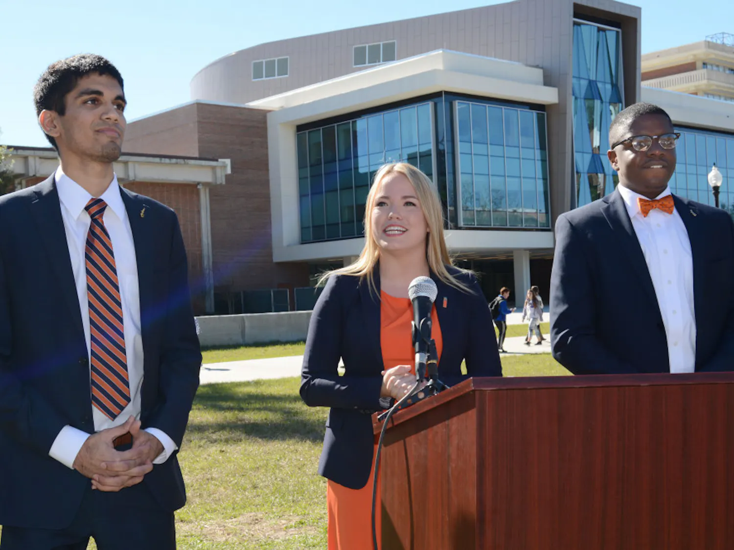 From left, Impact Party student body treasurer candidate Kishan Patel, 20, Impact Party student body president candidate Susan Webster, 22, and Impact Party student body vice-president candidate Brendon Jonassaint, 21, announce their candidacy to a crowd of students on the Reitz Union North Lawn on Jan. 20, 2016.