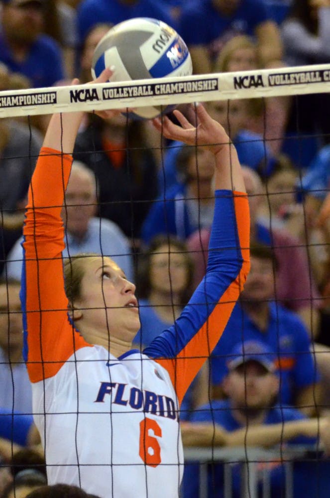 Mackenzie Dagostino sets the ball during No. 8 seed Florida's 3-1 win against Miami in the second round of the NCAA Tournament on Dec. 6, 2014, in the O'Connell Center.