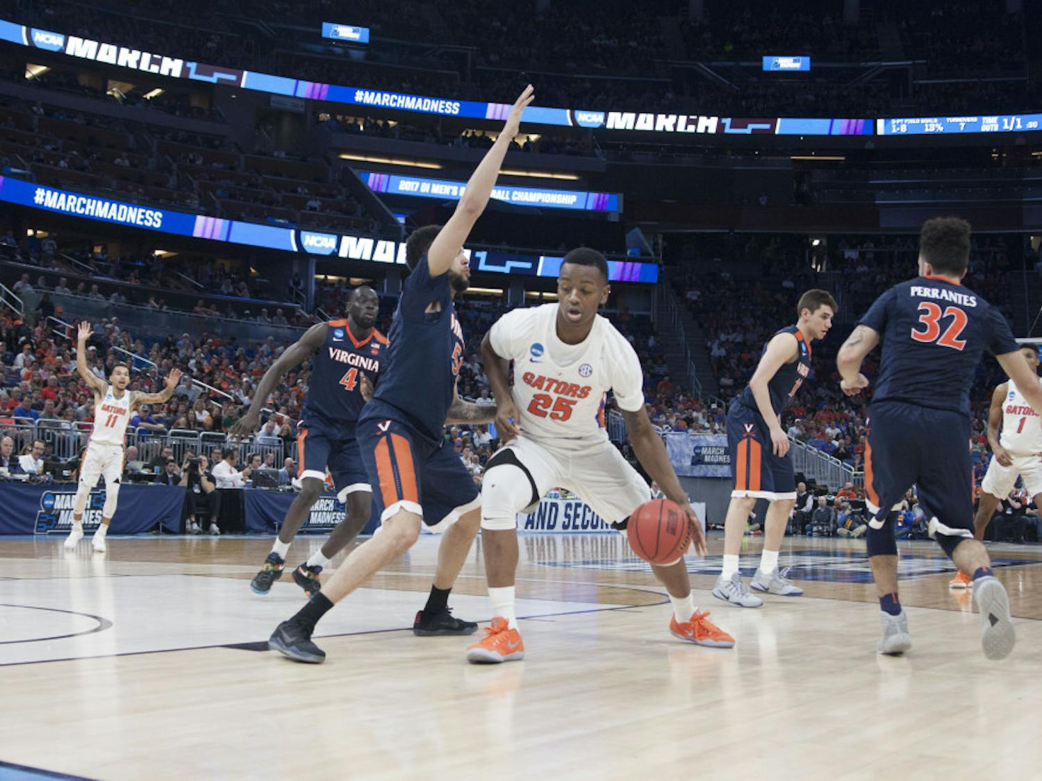 Keith Stone dribbles towards the basket during Florida's 65-39 second-round win against Virginia in the NCAA Tournament on March 18, 2017.