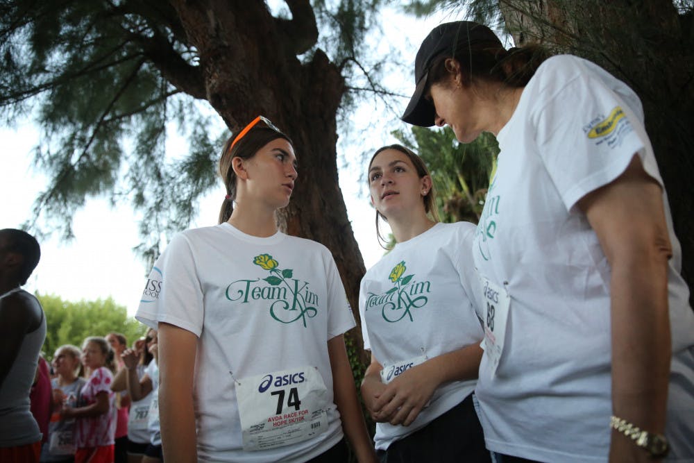 Sarah Lambert, 21, talking to friends before the Victimes of Domestic Abuse for Hope on Oct. 11, 2013.