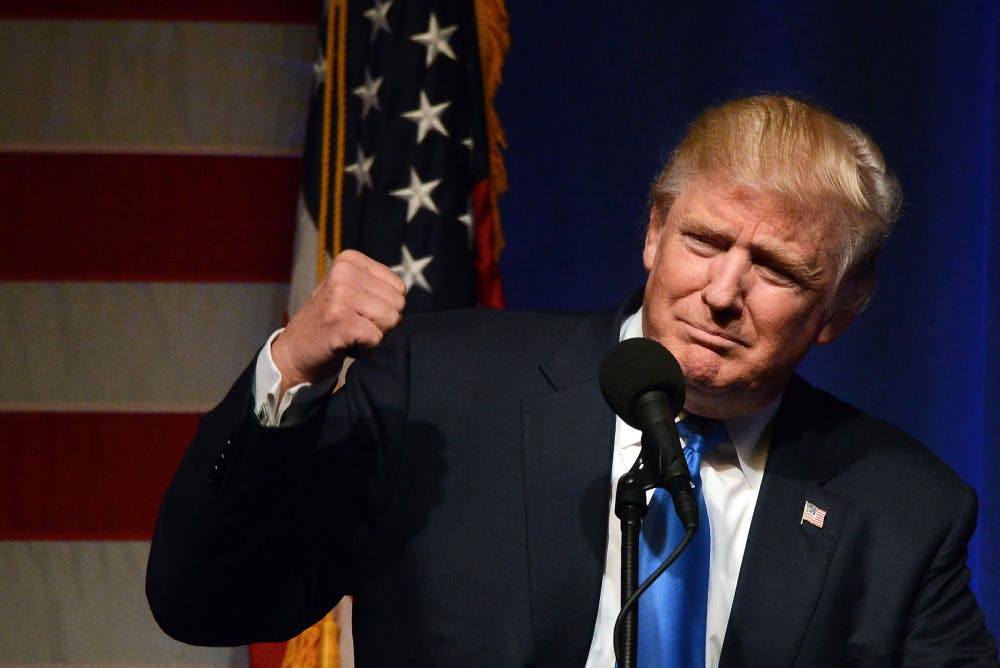 Republican presidential candidate Donald Trump pumps his fist during a campaign rally at the Lackawanna College Student Union in downtown Scranton, Pa., Monday, Nov. 7, 2016. (Butch Comegys/The Times &amp; Tribune via AP)