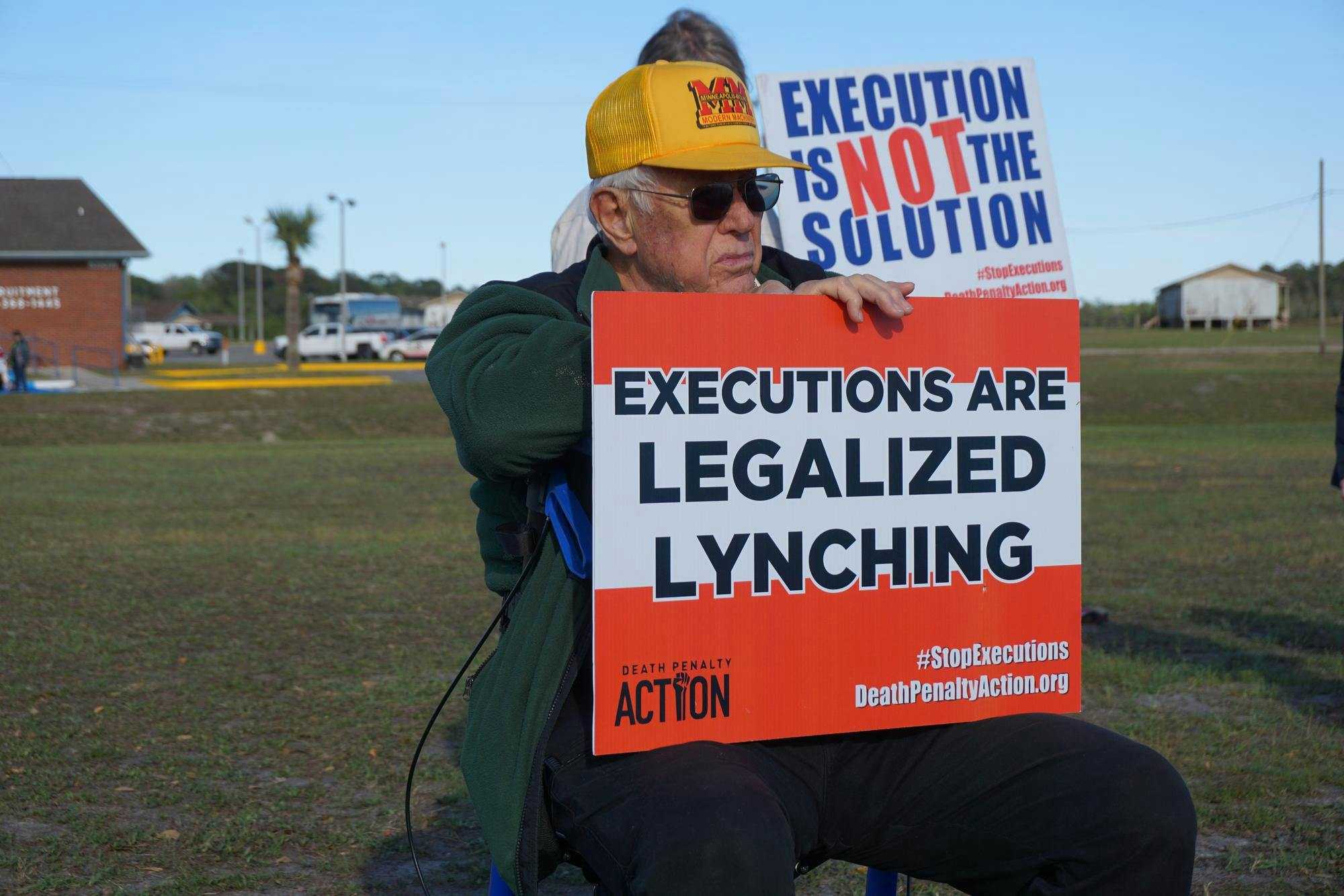 Protesters sit outside praying before the execution of Michael King, Tuesday, March 17, 2026, at Florida State Prison in Raiford, Fla.