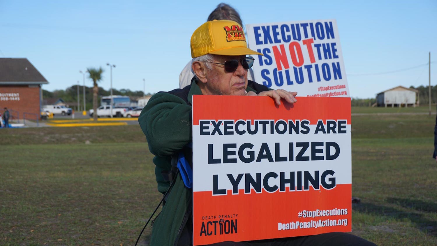 Protesters sit outside praying before the execution of Michael King, Tuesday, March 17, 2026, at Florida State Prison in Raiford, Fla.