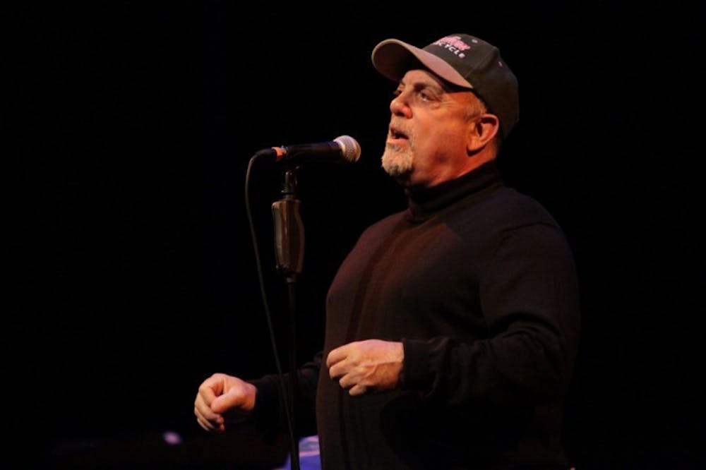 <p>Billy Joel speaks to a packed house at the Phillips Center for the Performing Arts on Thursday night. He performed several songs and answered questions from the crowd about his career and the music business.</p>