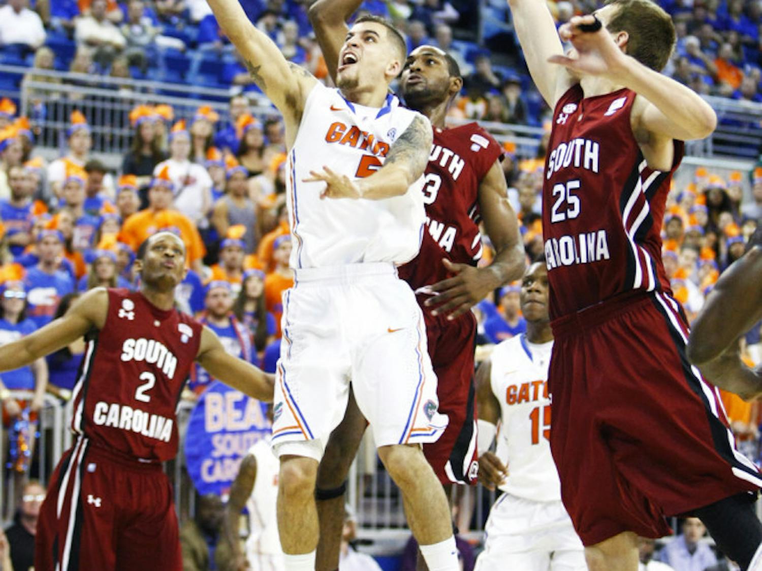 Guard Scottie Wilbekin (5) attempts a layup during Florida’s 75-36 win against South Carolina on Wednesday night in the O’Connell Center.