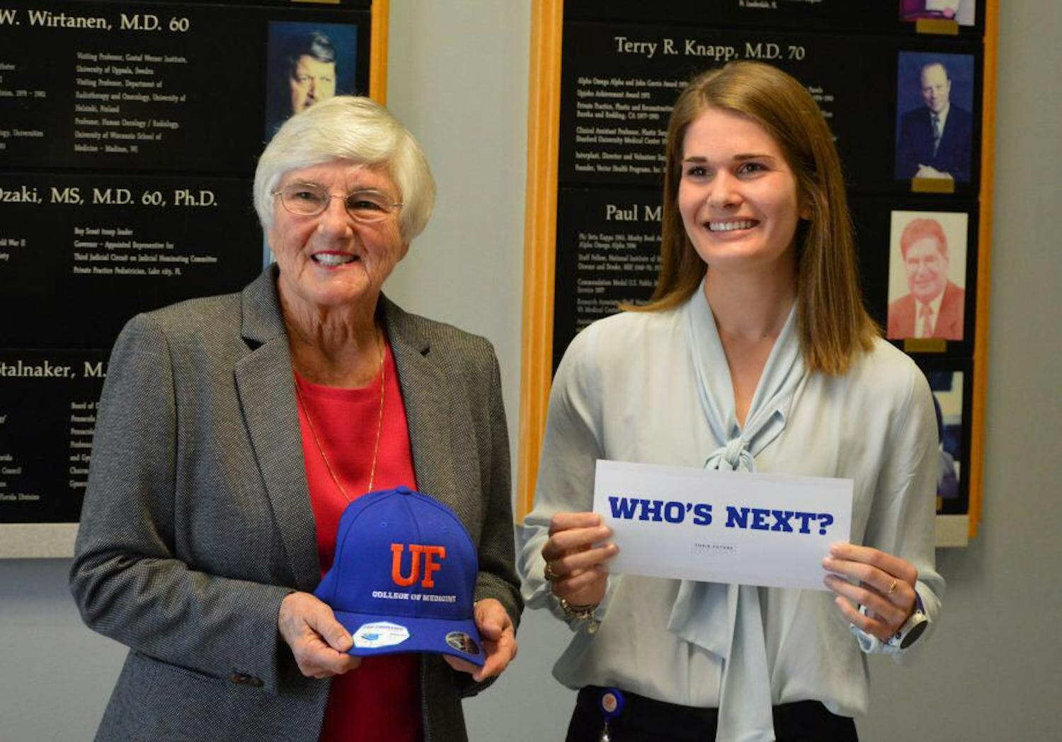 The first woman graduate of the UF College of Medicine, 81-year-old Dr. Jean Bennett, and Jane Harrell, a 23-year-old UF medical student, pose at a scholarship award ceremony in February. Harrell was awarded a yearly $5,000 scholarship named after Bennett.