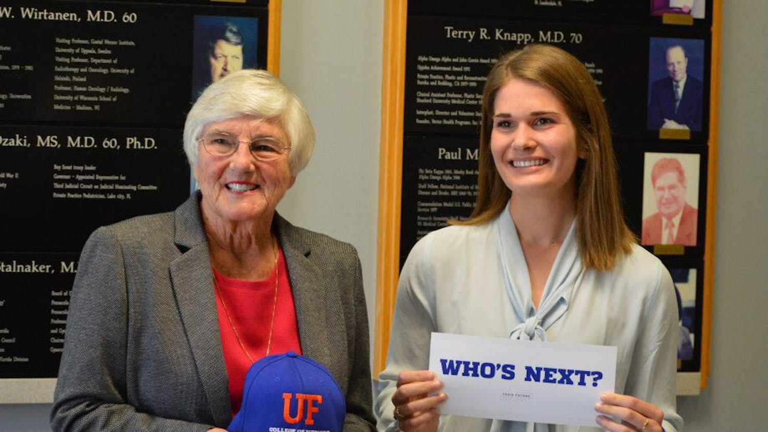 The first woman graduate of the UF College of Medicine, 81-year-old Dr. Jean Bennett, and Jane Harrell, a 23-year-old UF medical student, pose at a scholarship award ceremony in February. Harrell was awarded a yearly $5,000 scholarship named after Bennett.