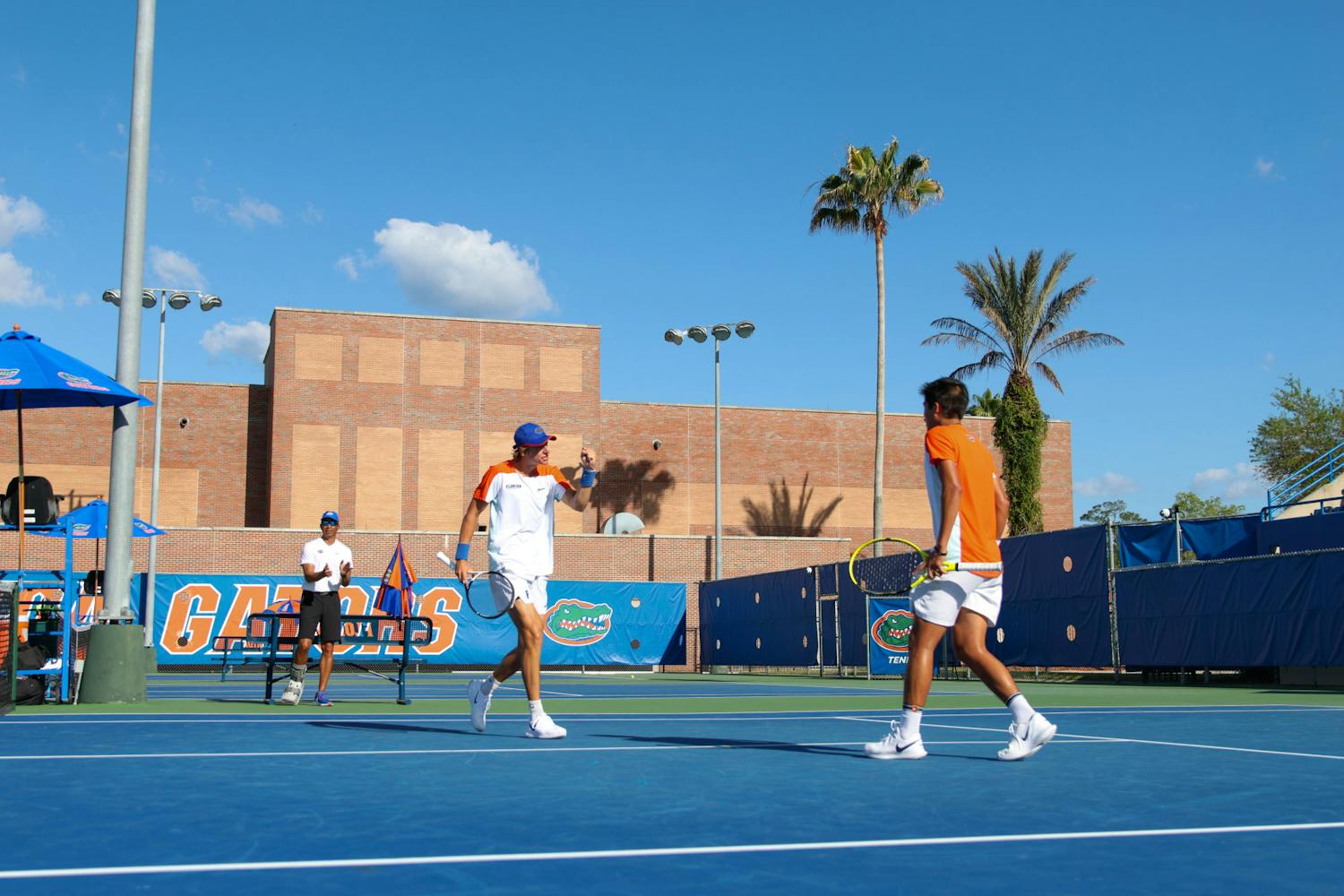 Florida sophomore Nate Bonetto and freshman Tanapatt Nirundorn compete in their doubles match during the Gators' men's tennis match game against the Arkansas Razorbacks Friday, March 24, 2023.