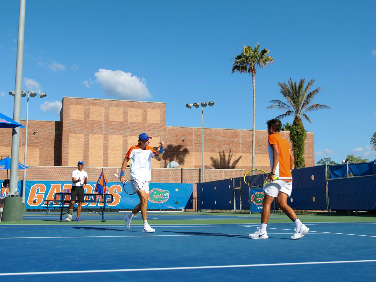 Florida sophomore Nate Bonetto and freshman Tanapatt Nirundorn compete in their doubles match during the Gators' men's tennis match game against the Arkansas Razorbacks Friday, March 24, 2023.