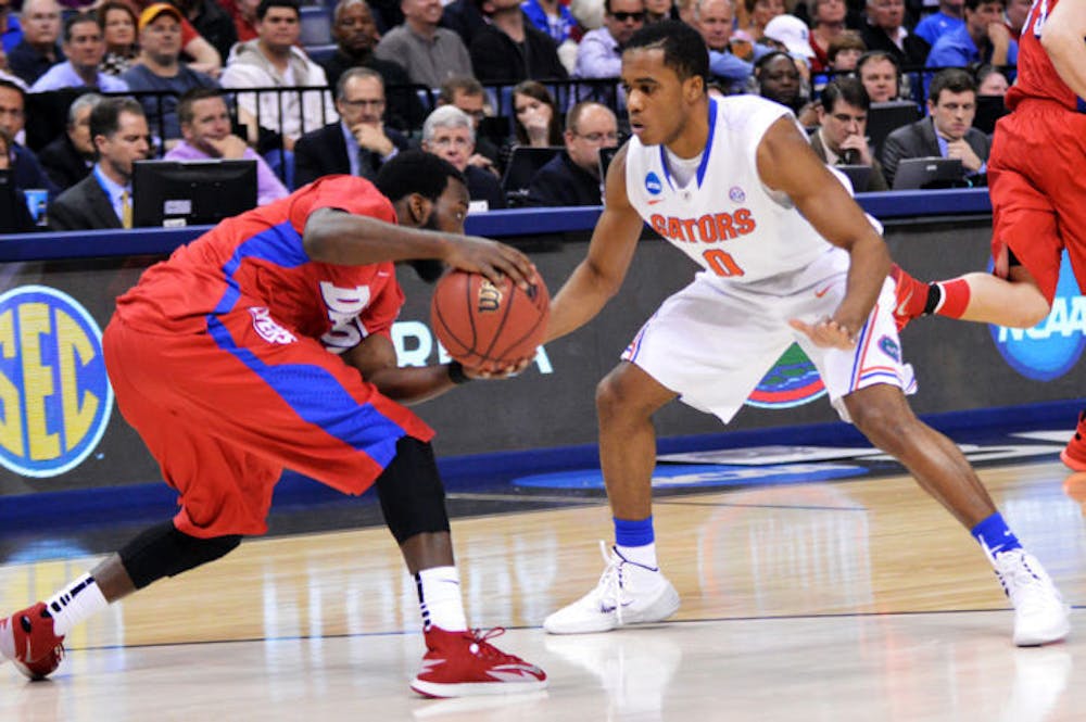 <p>Kasey Hill (0) defends Dayton’s Khari Price during the Gators’ 62-52 win over the Flyers on Saturday in FedExForum in Memphis, Tenn. Hill missed UF’s first game against UConn with an ankle sprain and is currently playing through turf toe.</p>