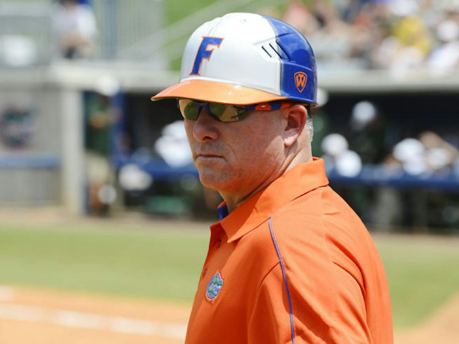 Coach Tim Walton studies the field during Florida’s 11-1 win against USF on May 18 at Katie Seashole Pressly Stadium. 