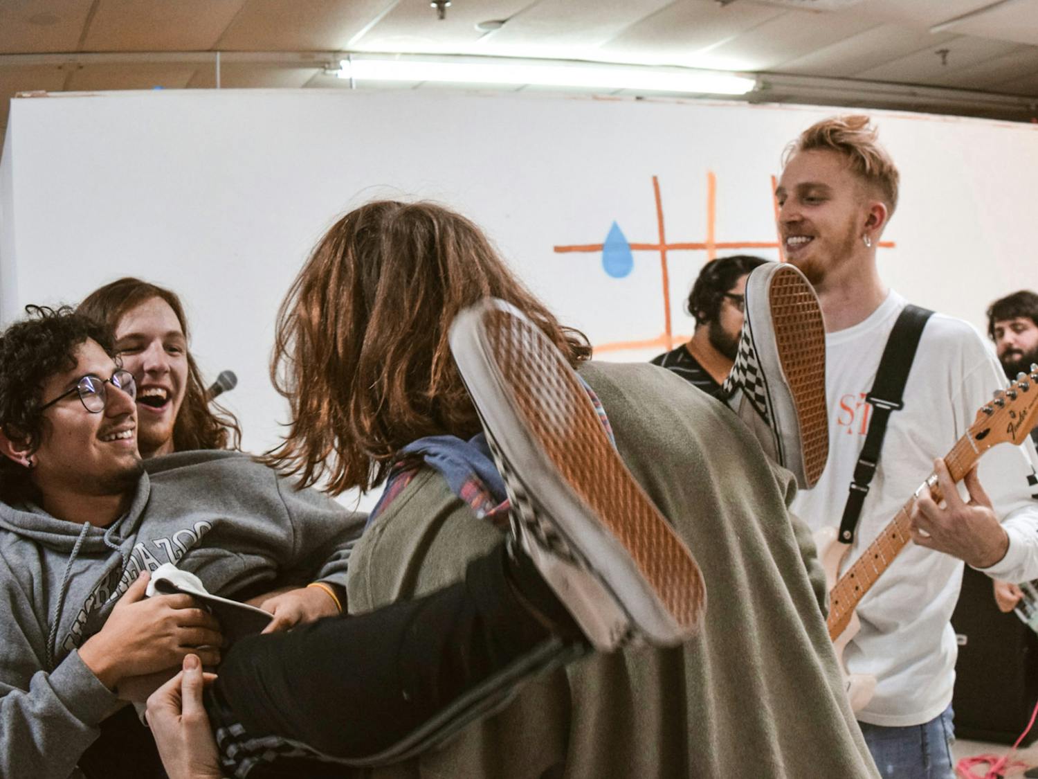 Daniel Villamil crowd surfs at a performance by local punk band The Real You at The Moisturizer Gallery Wednesday, Dec. 11, 2019.