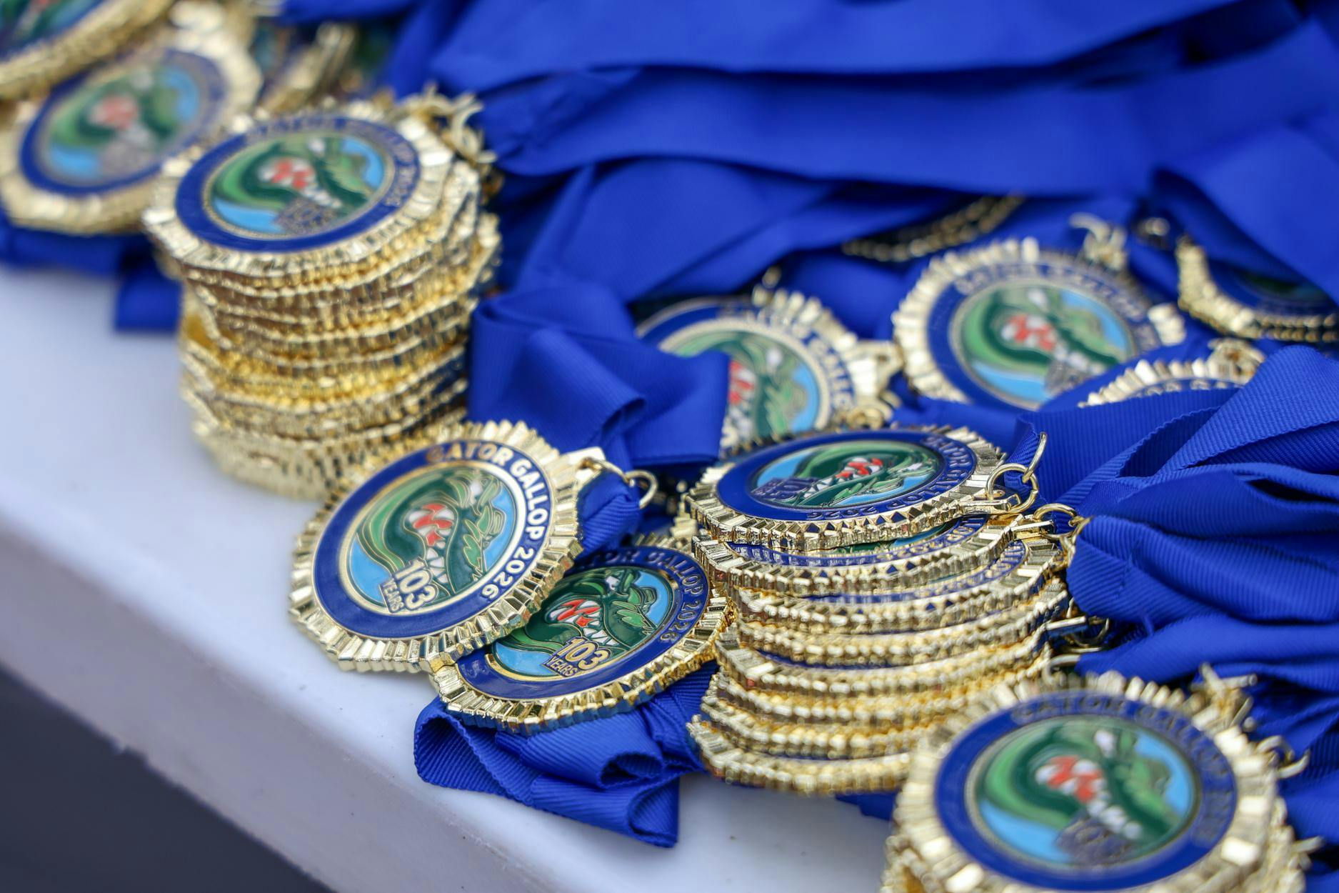 Finishers of the 2026 Gator Gallop receive medals on Gainesville’s Plaza of the Americas. The Gator Gallop kicked off University of Florida’s Homecoming Weekend on Friday, Oct. 9, 2026.