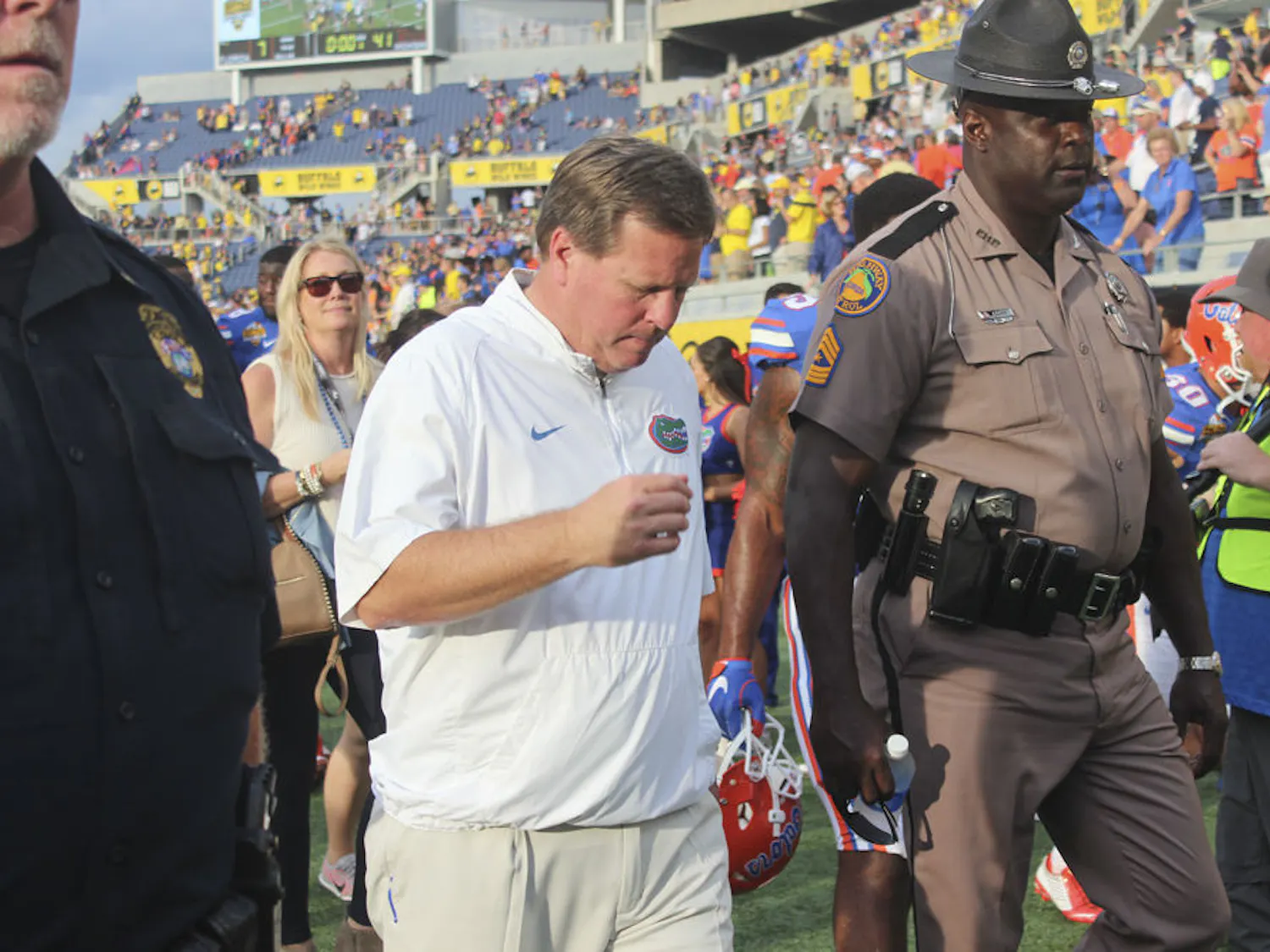 UF football coach Jim McElwain walks off the field following Florida's 41-7 loss to Michigan in the Citrus Bowl on Jan. 1, 2016, in Orlando.