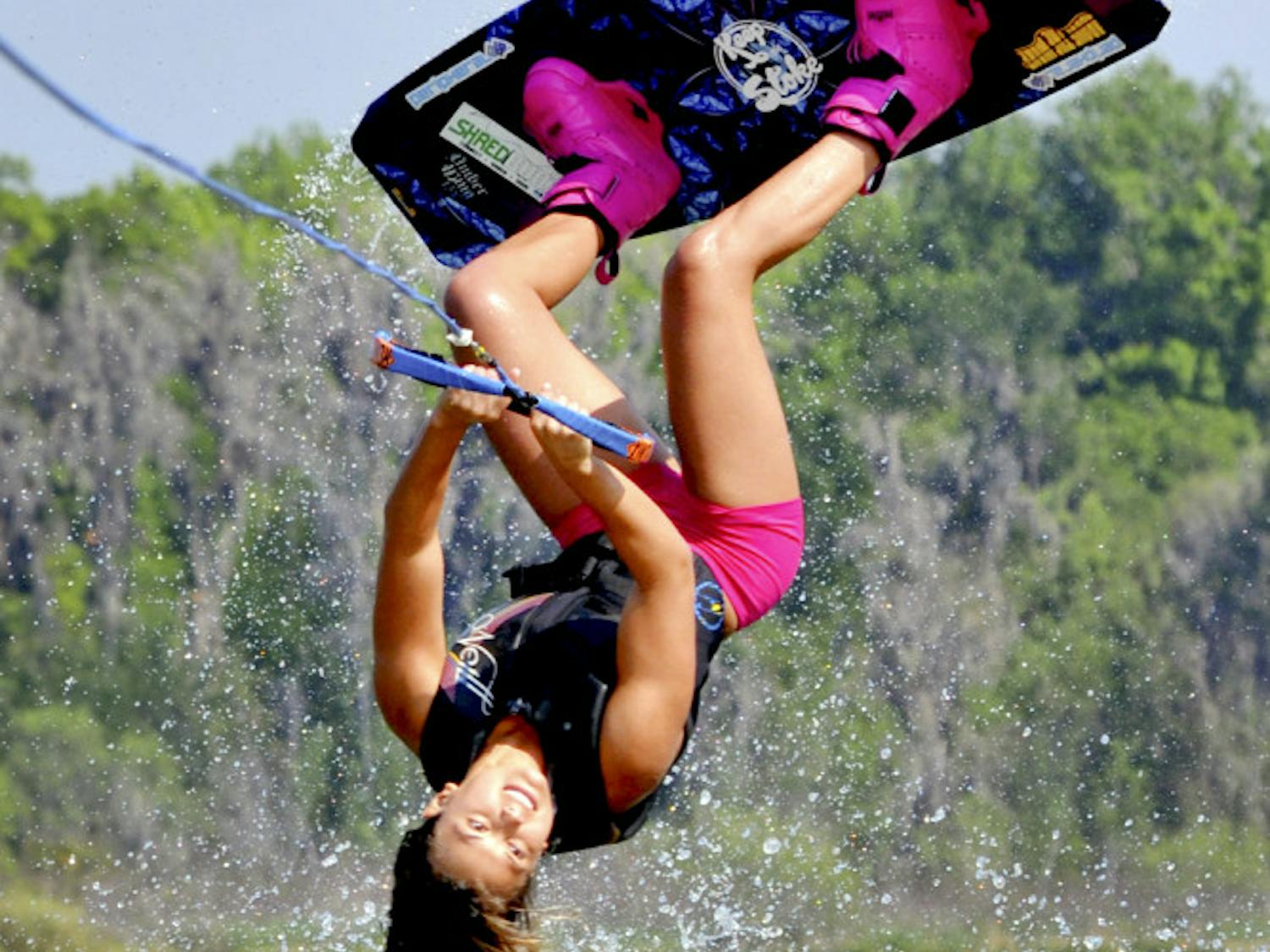 Dixie Smith, a 20-year-old UF biology senior, performs a wakeboard stunt on Lake Wauberg.