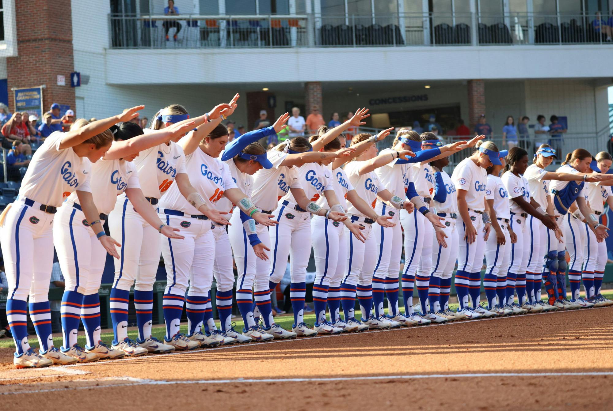 Florida softball lines up before its 13-4 win over the Georgia Bulldogs Friday, April 14, 2023.