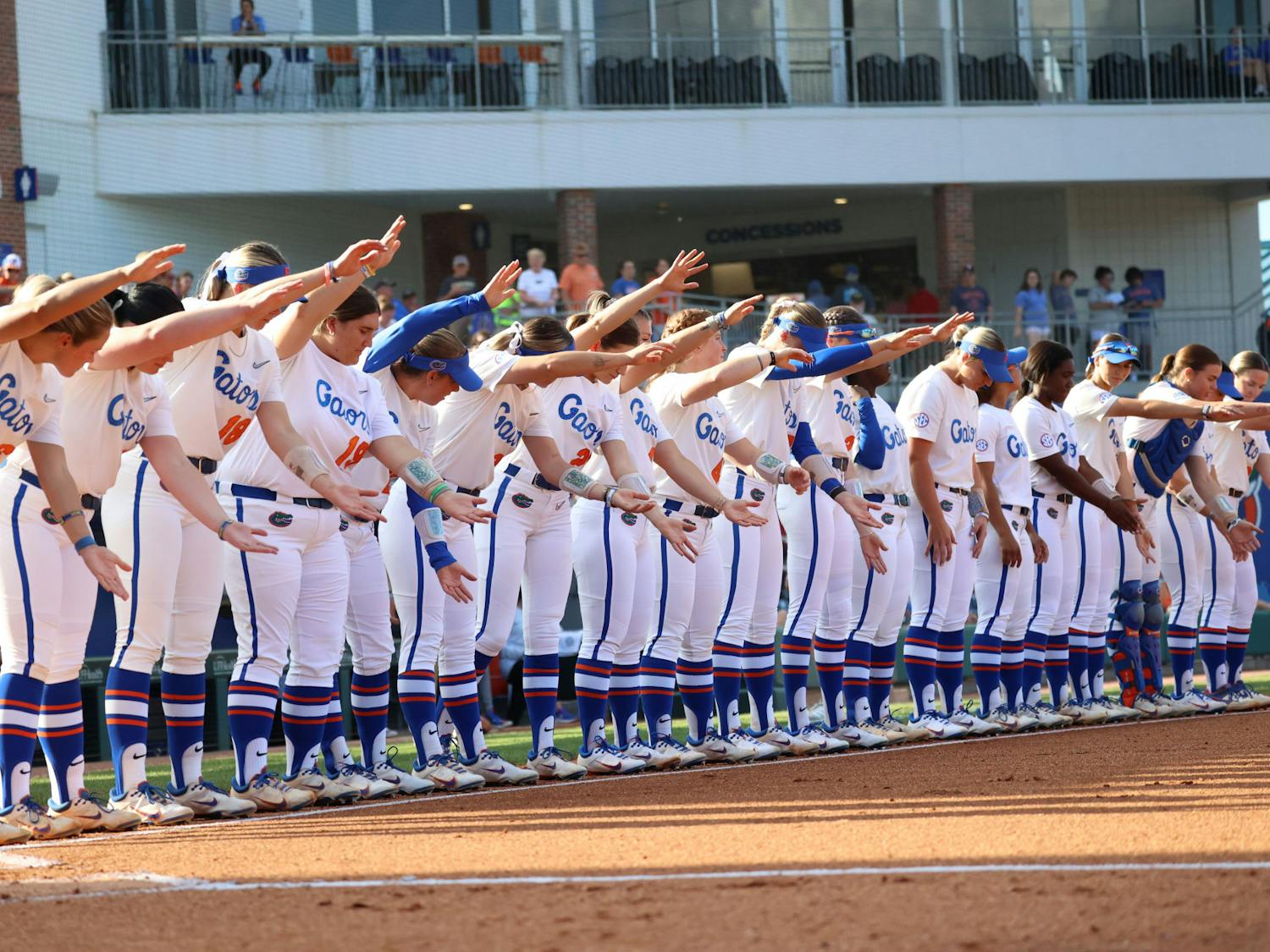 Florida softball lines up before its 13-4 win over the Georgia Bulldogs Friday, April 14, 2023.