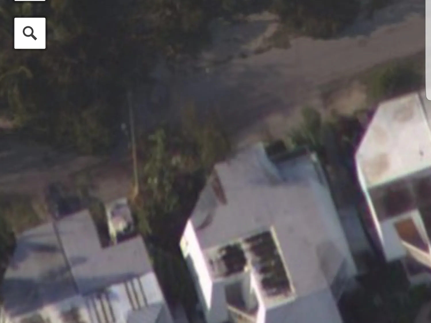 National Oceanic and Atmospheric Administration satellite images show Eric Higbie's Key West home home, center. The photo is the only way his family can judge the property's damage until they return to the island.