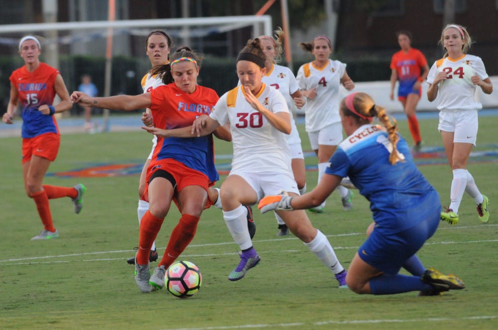 <p>UF forward Savannah Jordan fights for possession during Florida's 5-2 win against Iowa State on Aug. 19, 2016, at James G. Pressly Stadium.</p>