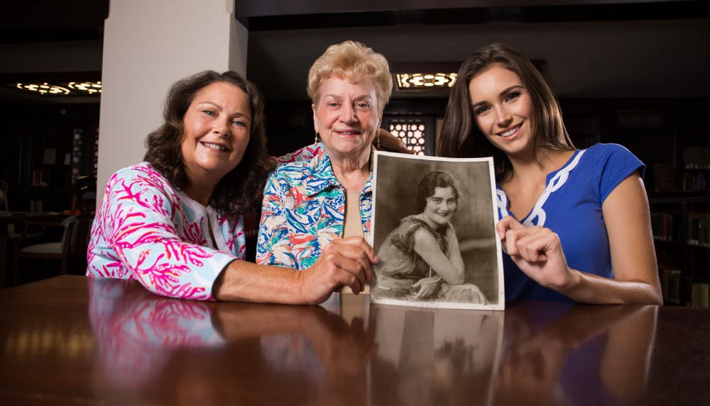 <p><span id="docs-internal-guid-15d70d09-d99f-317c-655f-20842848d6b5"><span>From left: Sara Uhrig, Edna Black Hindson and Hallie Uhrig hold a photo from 1925 of Lassie Goodbread Black. The picture was taken at Smathers Library during a video interview on July 29.</span></span></p>