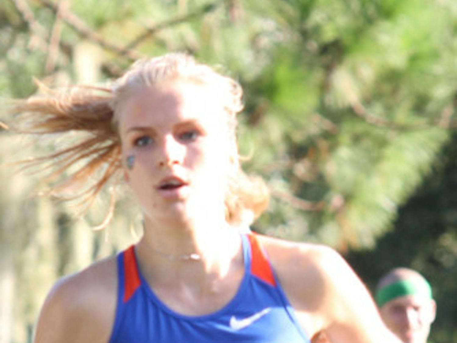 Junior runner Agata Strausa, runs in the Mountain Dew Invitational on Sept. 15 at the Mark Bostick golf course. 