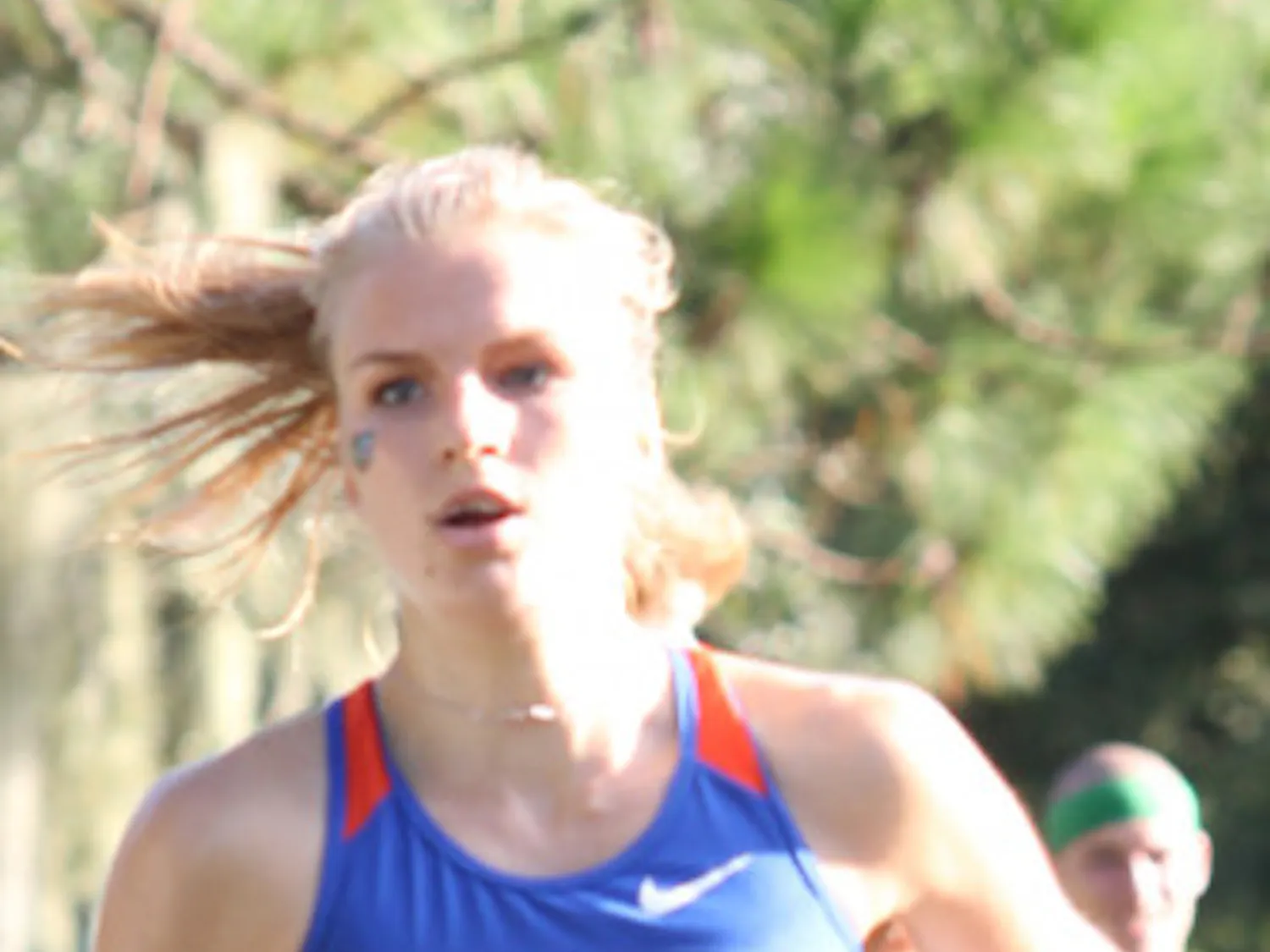 Junior runner Agata Strausa, runs in the Mountain Dew Invitational on Sept. 15 at the Mark Bostick golf course.