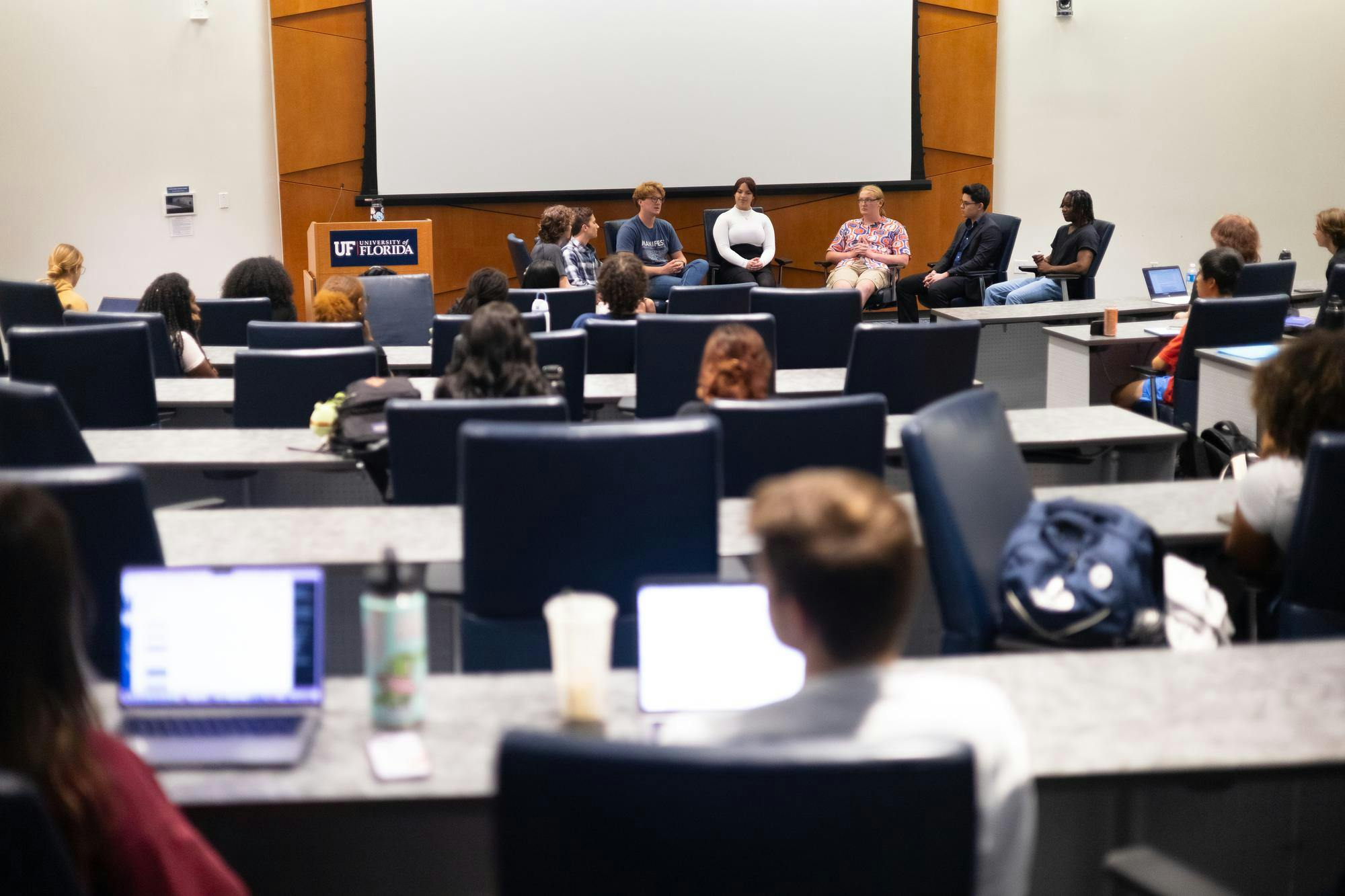 Students talk during a student-hosted debate in Reitz Union’s Senate Chamber on Thursday, Oct. 3, 2024.
