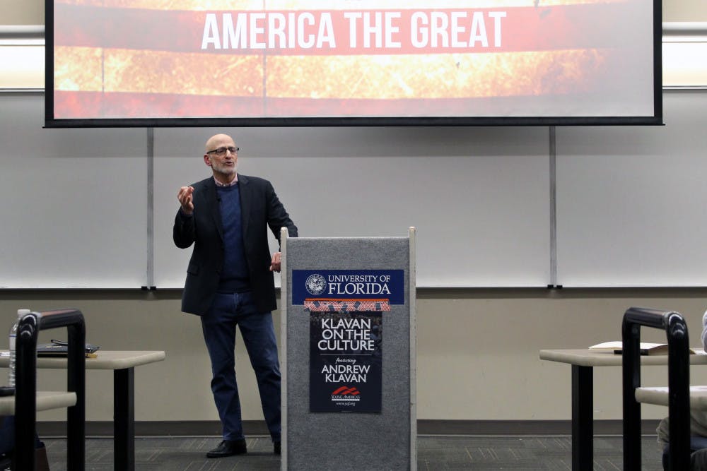 Andrew Klavan, crime novelist and outspoken conservative, speaks Thursday about various social and political issues to a crowd of over 100 people in a classroom in Turlington Hall. The event was hosted by UF’s Young Americans for Freedom. 