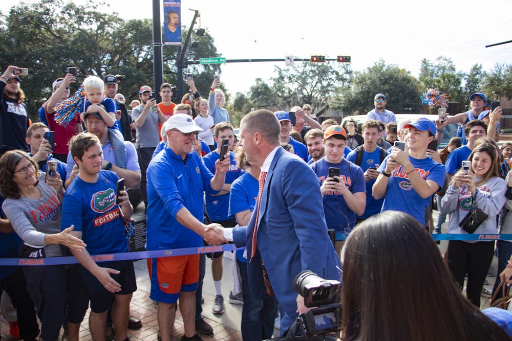 <p>Florida Football Coach Billy Napier arrives with his family at Ben Hill Griffin Stadium for his first day on the job on Sunday, Dec. 5, 2021. Napier has hired more than 37 staffers in just over a month as Florida head coach.</p><p></p>